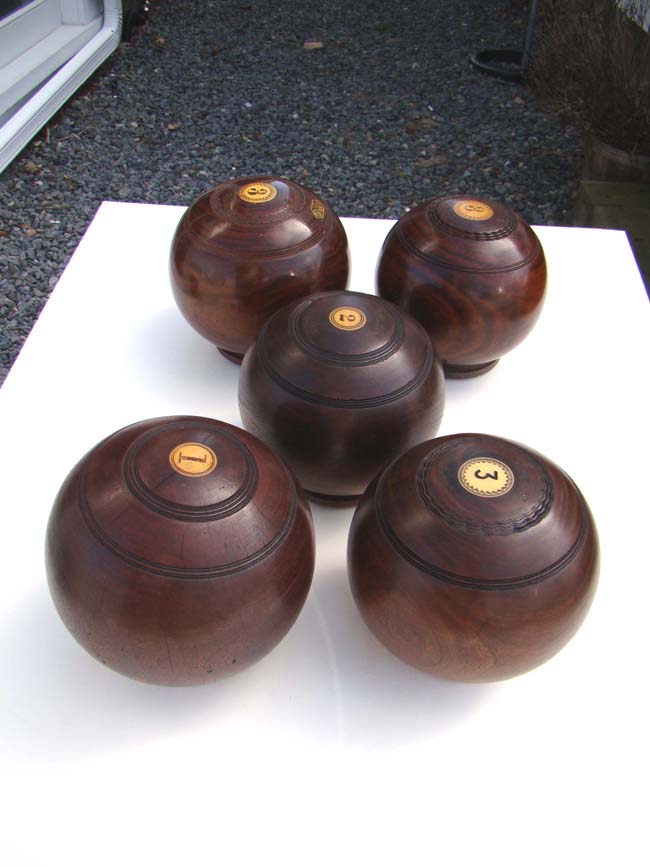 A collection of five Antique English Lignum Vitae Lawn Bowling Balls circa 1890-1920 — image 2